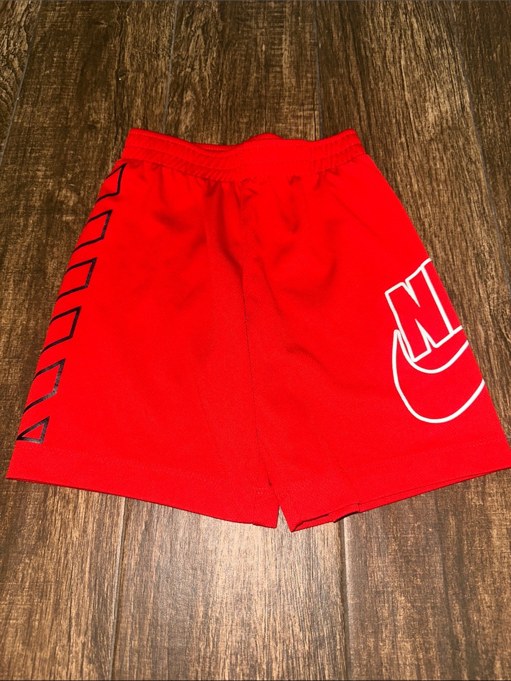 Nike boys Red Athletic Shorts with White Logo